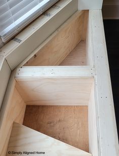 the bottom section of a window sill with some wood in it and one side missing