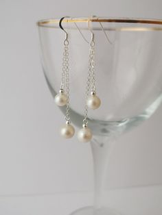 Long double pearl sterling silver drop earrings. Freshwater pearl earrings Pretty white freshwater pearl drop earrings. All parts sterling silver. Long pearl earrings. Dangly pearl earrings. Elegant Sterling Silver Nickel-free Pearl Earrings, Elegant Sterling Silver Pearl Earrings Nickel Free, Elegant Drop Pearl Earrings, Silver Drop Pearl Pendant Earrings, Silver Drop Pearl Earrings With Pearl Drop, Pearl White Drop Pearl Earrings In Sterling Silver, Elegant Silver Pearl Earrings Nickel Free, Silver Teardrop Pearl Chain Earrings, Elegant Nickel-free Dangle Pearl Earrings