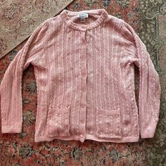 "Vintage pink cardigan. Long sleeves, open lightweight weave, with matching plastic buttons up the front.  Good condition.  Brand: Anthony Richards Size: Adult Large Material: Acrylic  Measurements: 29\" long 24\" pit to pit" Pink Open Knit Outerwear For Layering, Pink Cable Knit Outerwear For Spring, Casual Open Knit Cardigan For Daywear, Casual Pink Open Knit Outerwear, Vintage Open Knit Cardigan For Spring, Spring Pink Cable Knit Outerwear, Casual Pink Cable Knit Cardigan, Pink Casual Cable Knit Cardigan, Pink Cable Knit Casual Cardigan