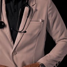 a black and white photo of a man in a suit with a stethoscope