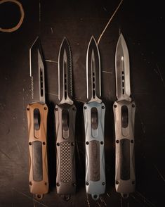 five knives are lined up in a row