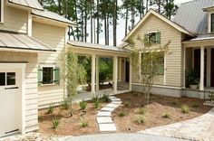 a house that is in the middle of a driveway