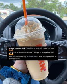 a person holding up a drink in front of a car steering wheel with the caption that reads, starbucks this drink is really fall in cup