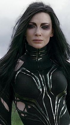 a woman with long black hair wearing a body suit