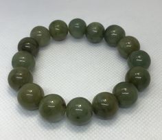 Beautiful, big, heavy jade beads. Handmade Round Jade Stretch Bracelet, Jade Stretch Bracelet With 8mm Beads, Disney Charms, Sterling Bracelets, Cameo Pendant, Yellow Gold Chain, Jade Beads, Handmade Artisan, Stretch Bracelet