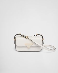 White Leather shoulder bag | PRADA Classic White Shoulder Bag With Metal Logo, Formal White Bags With Metal Logo, White Shoulder Bag With Metal Logo For Evening, Classic Rectangular Shoulder Bag With Metal Logo, White Formal Flap Bag With Branded Hardware, Formal White Flap Bag With Branded Hardware, Leather Crossbody Flap Bag With Metal Logo, Designer Formal Shoulder Bag With Metal Logo, Designer Metal Logo Shoulder Bag For Formal Occasions