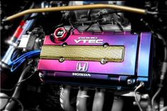 the engine of a honda car with colorful paint