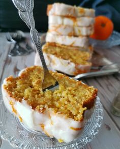 a piece of cake on a glass plate with a fork in it and two slices cut out