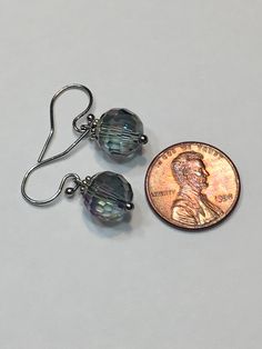 "Blue Aurora Borealis 10mm faceted disco ball glass beads, stainless steel hook wire dangling earrings. 1\" top to bottom, dangle 1/2 inches. Hand made Jewelry! Thanks for stopping by!" Nickel-free Crystal Earrings For Party, Nickel-free Round Crystal Earrings For Party, Hypoallergenic Round Crystal Earrings For Party, Adjustable Crystal Earrings With Faceted Beads, Hypoallergenic Crystal Earrings For Party, Adjustable Metal Earrings With Faceted Beads, Adjustable Czech Glass Earrings With Faceted Beads, Czech Glass Crystal Dangle Earrings, Hypoallergenic Round Bead Party Earrings