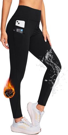 a woman in black leggings with fire and water on the side, showing her stomach