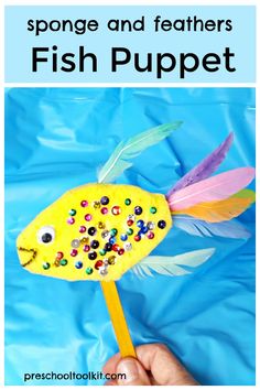 a fish puppet made out of paper and beads with the words sponge and feathers on it