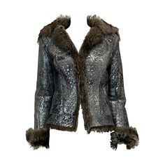 Warm and comfortable, a beautiful shearling jacket is a forever piece but that doesn't mean it can't have personality. This one by Cavalli's has a bohemian feel. It's made from shearling and contrasting leather reverse. Unlined. Labeled a size Small (US 2-4 / UK 8 / IT 40 / FR 36), the jacket runs true to size. Wear it with cargo pants and a lightweight knit. Remark : FW2006 Roberto Cavvalli velvet maxi skirt (pictures 3, 4, 5 & 16) is not sold with the Cavalli shearling jacket but will be avail Luxury Fur Coat For Winter Parties, Designer Faux Fur Trim Winter Coat, Luxury Party Outerwear With Faux Fur Trim, Long Sleeve Leather Jacket For Winter Evenings, Long Sleeve Leather Jacket For Evening In Winter, Evening Leather Jacket With Long Sleeves For Winter, Designer Winter Fur Coat With Faux Fur Lining, Designer Faux Fur Coat For Winter, Designer Winter Party Outerwear