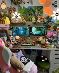 a room filled with lots of stuffed animals and toys on top of a desk next to a computer monitor