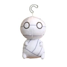 a white stuffed animal with black eyes and a chain on it's back end