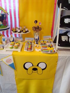 the table is set up for an adventure time birthday party