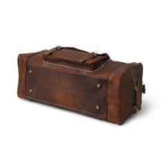 Trustpilot A leather travel duffle bag that is trendy, unique, and classy is a perfect match for your adventurous trips this leather duffle bag has four big pockets on the exterior with two buckles. This leather duffle bag is made of genuine goat leather which gives it a rustic look which is for everyone who is looking for something heavy-duty but with good looks. This leather bag has three compartments, one big compartment for all your clothes and shoes, and two small compartments with a zipper Vintage Leather Duffle Bag With Waxed Finish, Vintage Leather Duffle Bag With Soft Leather, Vintage Soft Leather Duffle Bag, Vintage Travel Duffle Bag With Leather Lining, Vintage Leather Satchel For Overnight Trips, Vintage Leather Satchel Duffle Bag, Vintage Leather-lined Duffle Bag For Travel, Leather Vintage Weekender Bag For Overnight Trips, Rugged Leather Duffle Bag With Waxed Finish