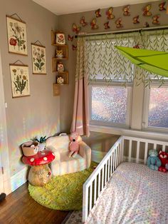 a baby's room is decorated in pink and green