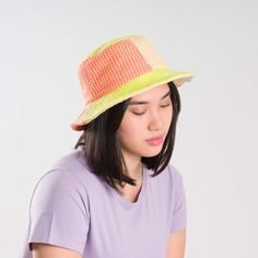 Knit bucket hat with raised contrast squiggle stripes. Made from colorful, soft hypoallergic yarn. From sunny summer beach days to cold winter walks, this bucket hat is destined for year-round wear. Each hat is one of a kind – patchwork pattern placement may vary, but that's the fun of it! Details Body: 100% Acrylic Lining: 100% Deadstock poly-cotton fabric Machine wash gentle, lay flat to reshape and dry8.5"w, 3.5"h, 2.25" brim, 22" interior circumference Casual Orange Straw Hat For Spring, Pink Lightweight Bucket Hat With Curved Brim, Lightweight Pink Bucket Hat With Curved Brim, Multicolor Casual Bucket Hat, Pink Lightweight Brimmed Bucket Hat, Lightweight Pink Brimmed Bucket Hat, Casual Lightweight Multicolor Sun Hat, Casual Multicolor Lightweight Sun Hat, Casual Multicolor Bucket Hat For Spring