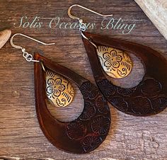 "OOAK Hand Embossed & Hand Dyed Leather Teardrop style earrings. These are gorgeous!  Real leather teardrop cutout earrings that have been hand embossed and dyed in a deep brown.  Matching brass dangle is the center focal of these beauties and they are complete with Sterling Silver ear wires. Measuring approximately 2-1/4\" in length. Made with real vegetable tanned leather. Made by Solis Occasus Bling." Hand Tooled Teardrop Bohemian Earrings, Bohemian Hand Tooled Teardrop Earrings, Artisan Hand-tooled Teardrop Earrings, Bohemian Teardrop Hand Tooled Earrings, Bohemian Stamped Earrings, Unique Hand-tooled Teardrop Earrings, Diy En Cuir, Diy Earrings Easy, Handmade Leather Jewelry