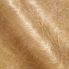 a close up view of the texture of an animal's fur on a wooden surface