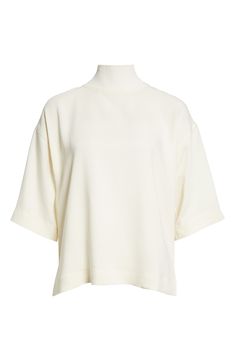 Deconstructed ease defines a mock-neck knit top fashioned in a boxy silhouette and framed by elbow-length sleeves. Mock neck Elbow-length sleeves 97% viscose, 3% elastane Hand wash, dry flat Imported Elegant White Turtleneck Knit Top, White Turtleneck Tops For Work, Oversized Turtleneck Top For Work, Modern High Neck Tops For Workwear, Spring White Mock Neck Top For Work, Chic Mock Neck Top With Short Sleeves For Work, Classic Oversized Turtleneck Top, Oversized Classic Turtleneck Top, White Short Sleeve Knit Top For Work