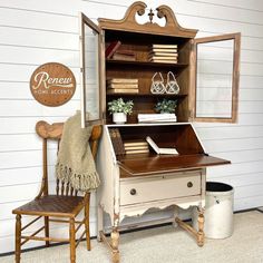 an old fashioned desk and chair in a room