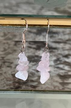 handmade crystal chip earrings. each rose quartz quartz crystal is handpicked by me personally to ensure that the jewelry is as perfect as possible. these beautiful light pink to clear crystals vary in color and tone to gives you a gorgeous, feminine look. pair them with our rose quartz crystal chip necklace or our rose quartz crystal necklace for a more elegant or themed look.  -- 🌹 Rose quartz properties 🌹-- Rose Quartz is a popular and revered crystal known for its delicate pink color and a Crystal Chip Necklace, Rose Quartz Properties, Chip Earrings, Quartz Properties, Chip Necklace, Pink Crystal Earrings, Fairy Jewelry, Birthday Gift For Women, Rose Quartz Earrings