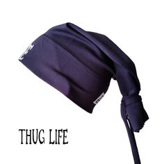 Thug Life Beanie Tie in Navy is 90s-inspired by the iconic style of the legendary 2Pac, by Street Knowledge brand, that effortlessly merges streetwear with a touch of nostalgia and street fashion to your wardrobe. Available in two sizes: S/M and L/XL Made of very soft quality material (95% cotton and 5% polyester) Brand new S/M - width: 26.5 cm, length: 44 cm. L/XL - width: 28.5 cm, length: 46 cm. Material: 95% cotton, 5% polyester Fitted Hats For Streetwear, Street Knowledge, Thug Life Tattoo, Hip Hop Hat, Iconic Style, 90s Inspired, Thug Life, Bulgaria, Style Icons