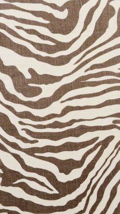 an animal print fabric with brown and white stripes on it's surface, as if in the wild