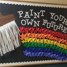 a blackboard with white fringes and paint your own future written in rainbow colors