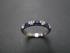 A wedding band set with diamond and emerald cut blue sapphire made in 14k white gold. Product Specifications: Type: 3 Radiant/Emerald cut Natural Blue Sapphire Type: 4 Round Brillant Cut Diamond with total carat weight of 0.12cttw Quality: D-F in Color and VS with Heart and Arrow (Ideal cut) Precious Metal: 14K White Gold Ring Width: Approx. 2.2mm Currently made to order pieces may take up to 10 business days to complete, or let me know if you need it urgent. You may also like: A similar ring ma Channel Set Emerald Cut Sapphire Rings, Channel Set Sapphire Rings With Emerald Cut, Emerald Cut Sapphire Channel Set Rings, Emerald Cut Sapphire Ring With Channel Set For Anniversary, Wedding Sapphire Ring Channel Set Baguette Cut, Wedding Sapphire Ring, Baguette Cut With Channel Set, Blue Sapphire Ring With Single Cut Diamonds For Wedding, Blue Diamond Ring With Single Cut Diamonds For Wedding, Sapphire Diamond Ring Channel Set For Wedding