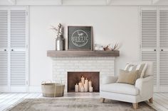 a living room with a fireplace and white shutters on the walls, along with candles