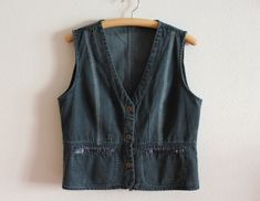 "Women's Vest Denim Vest Womens Denim Vest Fitted Jeans Waistcoat Metal Buttons Womens Country Western Boho Sleeveless Jean Jacket Large Size  Measurements (lying flat): Length: 22\"/ 56 cm Pit to pit: 20 3/4\"/ 52.5 cm Waist: 19\"/ 48 cm Please check measurements to insure a proper fit. Remember to allow yourself some extra room for movement. You can compare these with something from your closet that fits you well. Condition: Great Vintage Condition Material: 100%cotton N.B. Color may slightly differ from picture SHIPPING * I ship worldwide via Priority mail  * Items are shipped 1 - 3 business days after receiving the payment. * I ship from Europe, so please allow 2 to 4 weeks for the package to arrive if you live overseas. * Europe 5 - 10 business days. J 729" Jeans Waistcoat, Sleeveless Jean Jackets, Womens Denim Vest, Vest Denim, Fitted Jeans, Vest Womens, Womens Denim, Western Boho, Vest Outfits