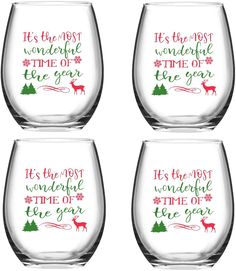 four wine glasses with the words it's the most wonderful time of the year