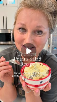 a woman is holding a bowl of food in her hand and making a funny face