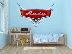 the logo for an auto shop wall decal in a child's room with a bed and desk