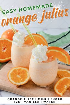 an orange juice drink with whipped cream on top and sliced oranges in the background