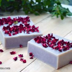 two soap bars with rose petals on them