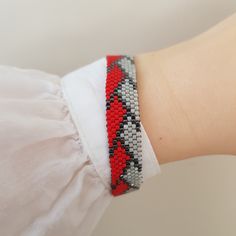 Red Miyuki Bracelet - Gray Cuff Bracelet - Everyday Bracelet For Her - Geometric Design Bracelet - Japanese Jewelry for her Made with love in Istanbul ❣️ * This beadwork is made of high quality Miyuki Japan beads. * Very light on the wrist, feels nice on the skin. * Each element is sewn by hand. * Comes in a variety of colors. * With an adjustable closure. * Perfectly complement both the daily option and the evening one. * This product can be custom-made in a different combination of colors and Flexible Beaded Bracelet For Gift, Flexible Beaded Bracelets As A Gift, Flexible Bangle Bracelet As Gift, Adjustable Flexible Cuff Bracelet As Gift, Adjustable Flexible Cuff Bracelet Gift, Adjustable Beaded Bracelet For Gifts, Flexible Adjustable Beaded Bracelet For Gift, Adjustable Flexible Bangle For Gifts, Elegant Red Friendship Bracelets