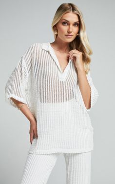 Elevate your everyday looks with the Cessily Top - V Neck Oversized Sheer Blouse in White. This stunning blouse is perfect for adding a touch of elegance to your casual outfits. The sheer mesh fabric creates an effortlessly chic look, while the v-neck and 3/4 sleeves add a flattering touch. Made from high-quality polyester, this top is both comfortable and durable. Whether you're heading to brunch or a night out with friends, this versatile piece will have you looking stylishly put together. Pai Wide Leg Jeans Shoes, Mum Jeans, Basic Black Dress, Neon Outfits, Spring Maxi Dress, Bachelorette Dress, Winter Capsule Wardrobe, Long Sleeve Knit Dress, Shirt Blouses Tops