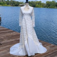 a white dress is on a wooden dock