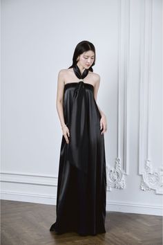 This ethereal silk dress features a halter tie-neck and elongated floor length for a graceful, luxurious silhouette. Crafted from premium mulberry silk, this dress exudes elegance and opulence. Perfect for special occasions or a night out, it will make you feel like a true high-end fashionista. *The length is measured from the chest to the hem. Luxury Halter Neck Bias Cut Maxi Dress, Luxury Bias Cut Halter Maxi Dress, Luxury Bias-cut Floor-length Silk Dress, Luxury Black Silk Maxi Dress, Silk Floor Length Dress, Luxury Stretch High-neck Maxi Dress, Floor Length Dress, Mean Blvd, Floor Length Dresses