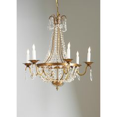 a chandelier with five candles hanging from it