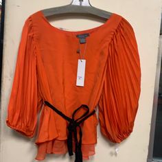 Beautiful Orange Color Top Spring Orange Office Tops, Orange Tops For Office In Spring, Orange Office Top For Spring, Orange Tops For Office Spring Season, Chic Orange Party Blouse, Trendy Formal Blouse For Spring, Chic Orange Tops For Work, Chic Orange Tops For Workwear, Chic Orange Fall Blouse