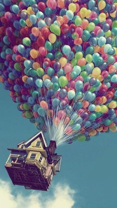 a house is floating in the air with balloons attached to it's roof and bottom