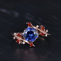 a blue ring with red and white stones