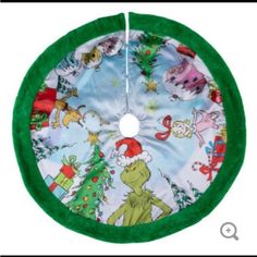 the grinch christmas tree skirt is hanging on a white background with green and red trim