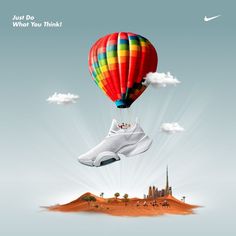 a pair of shoes floating in the air over a desert area with a castle and sky background