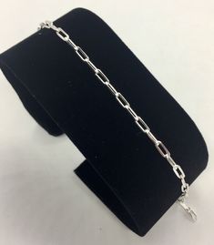 This bracelet is made with genuine sterling silver. The links are made in Paper clip style and are 2.5 in width. The weight of the bracelet is 2.7 grams and has a lobster lock. It is marked 925 for authenticity of metal. The bracelet looks beautiful by itself or with a little charm. Very classy and trendy! Silver Sterling Paperclip Bracelet, Sterling Silver Paperclip Bracelet In Silver, Formal Silver Bracelet With Paperclip Chain, Sterling Silver Paperclip Chain Bracelet For Everyday, Silver Sterling Silver Paperclip Bracelet, Sterling Silver Bracelet With Paperclip Chain For Everyday, Silver Paperclip Chain Bracelet For Formal Occasions, Sterling Silver Paperclip Bracelets As Gift, Silver Paperclip Chain Bracelets As Gift