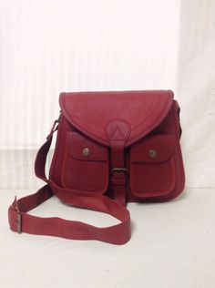 "Cross body Saddle Bag, Red Leather,bags purses,Purse, CrossBody Purse, leather Shoulder Bag Belt closure Soft fabric lined interior with two slip pockets and one zip close pocket Two snap button pockets under closing flap on front exterior PLEASE SEE MEASUREMENTS Measures: W 12\" x H 11\" x Depth 3\" Straps: Drop 24\" Excellent condition.This is new /old stock and has never been used. Really nice perfectly clean inside and out. 242-273-105+280+87+dn Cross body Saddle Bag, Red Leather,bags purse Saddle Bag Purse, Crossbody Saddle Bag, Field Bag, Red Leather Bag, Purse Crossbody, Leather Cross, Saddle Bag, Bags Purses, Leather Bags